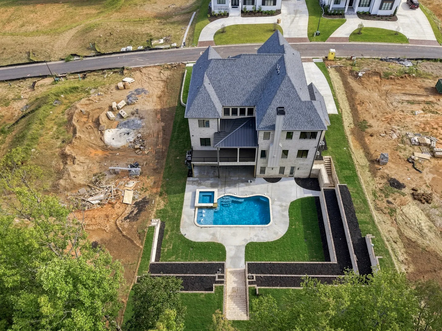Aerial view of a Suwanee Preserves backyard with pool and spa